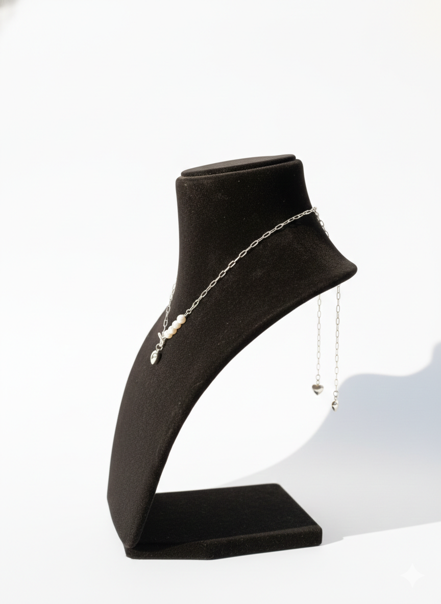 Silver chain necklace with a heart pendant and pearls