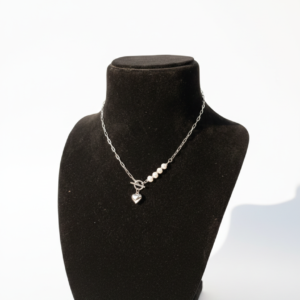 Silver chain necklace with a heart pendant and pearls