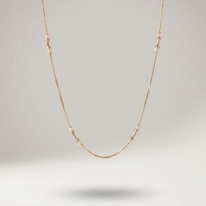 Elegant Gold Pearl Station Necklace