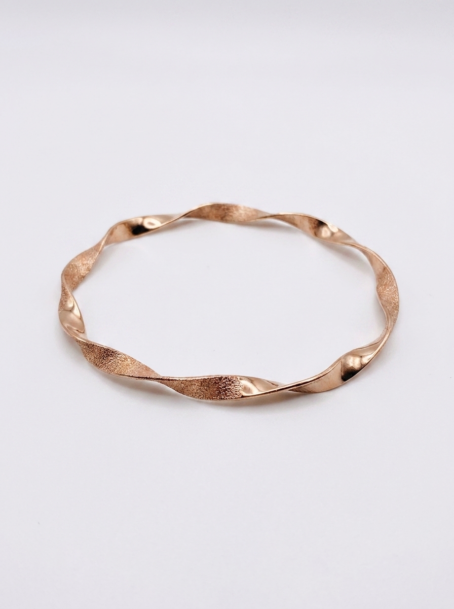 Elegant Twisted Rose Gold Bangle